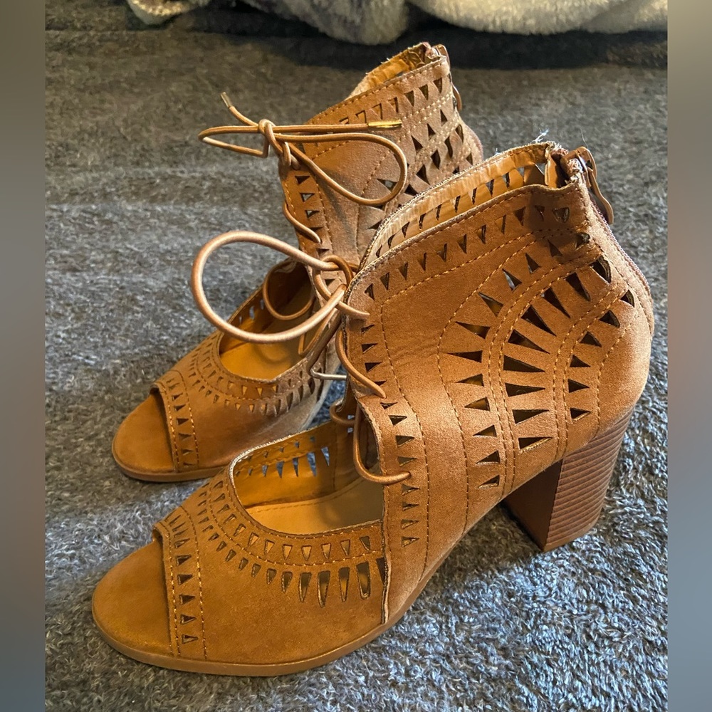 Eyelet cutout lace up heels. Lightly worn, size 8.